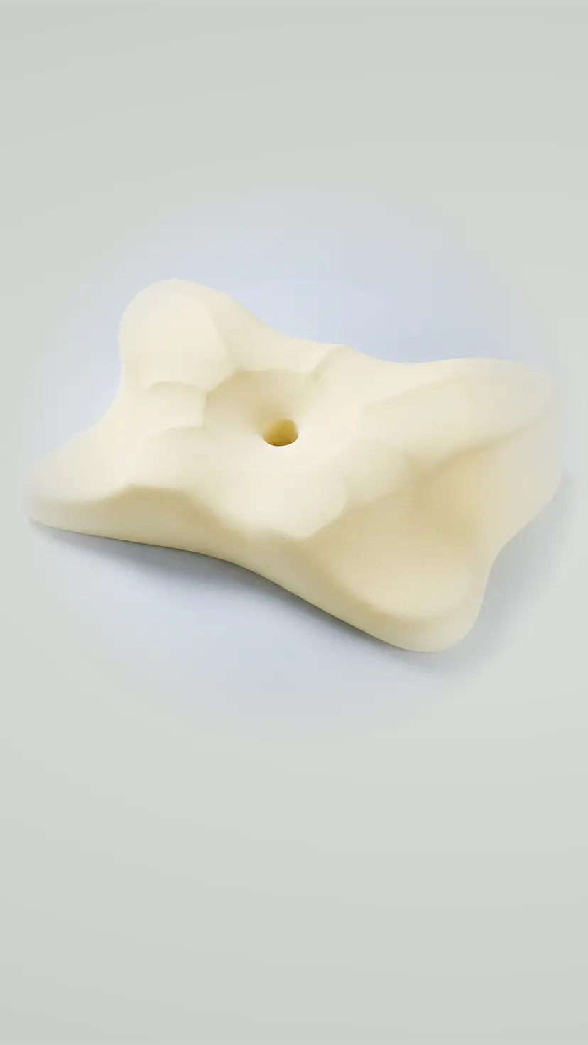 The memory foam core of the pillow with the cover removed